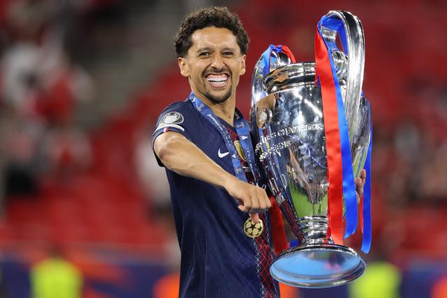 Paris Saint-Germain's Brazilian defender #05 Marquinhos lifts the trophy after winning the UEFA Champions League final football match between Paris Saint-Germain (PSG) and Arsenal FC at the Puskas Arena in Budapest on May 30, 2026. (Photo by Odd ANDERSEN / AFP)