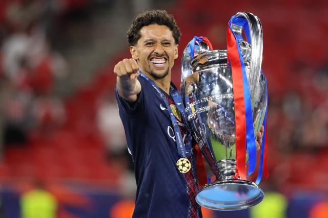 Paris Saint-Germain's Brazilian defender #05 Marquinhos lifts the trophy after winning the UEFA Champions League final football match between Paris Saint-Germain (PSG) and Arsenal FC at the Puskas Arena in Budapest on May 30, 2026. (Photo by Odd ANDERSEN / AFP)