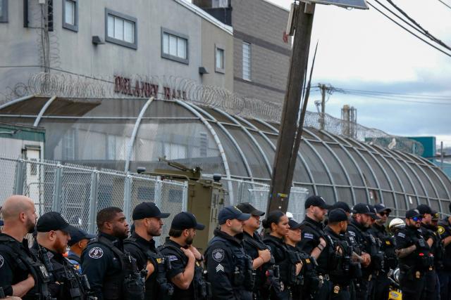 New Jersey State police officers stand guard outside Delaney Hall, which is being used as an Immigration and Customs Enforcement (ICE) detention center, in Newark, New Jersey, on May 30, 2026. New Jersey state authorities announced on May 29 they were taking charge of security outside a US immigration detention center after clashes between ICE agents and protesters angered by conditions faced by detainees inside. (Photo by Kena Betancur / AFP)