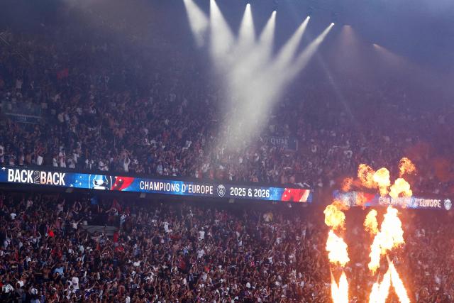 PSG supporters who watched on a giant screen the UEFA Champions League final between Paris Saint-Germain (PSG) and Arsenal FC played in Budapest, celebrate after PSG won, at the Parc des Princes stadium, in Paris on May 30, 2026. (Photo by Kenzo TRIBOUILLARD / AFP)