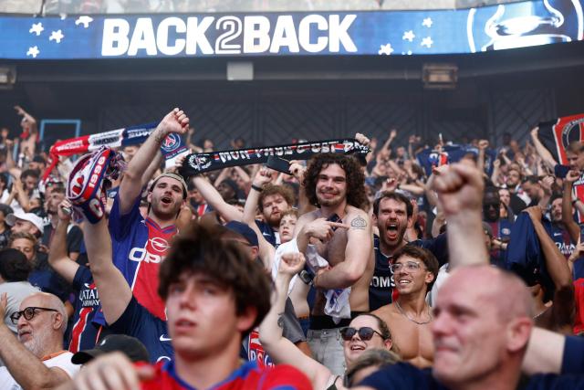 PSG supporters who watched on a giant screen the UEFA Champions League final between Paris Saint-Germain (PSG) and Arsenal FC played in Budapest, celebrate after PSG won, at the Parc des Princes stadium, in Paris on May 30, 2026. (Photo by Kenzo TRIBOUILLARD / AFP)