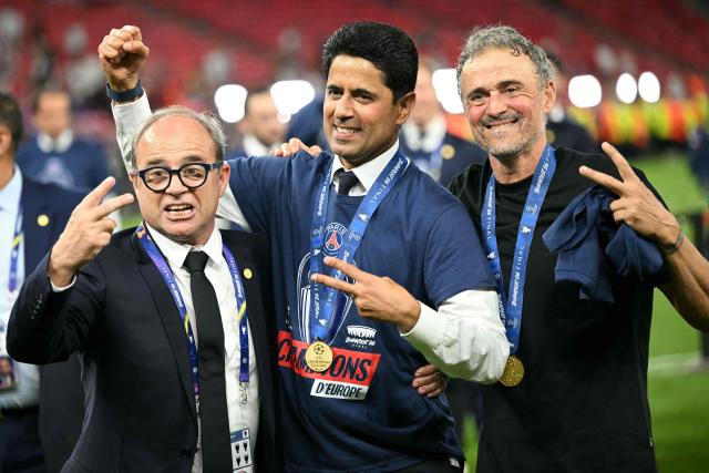 (LtoR) Paris Saint Germain's Portuguese Football Advisor Luis Campos, Paris Saint Germain's Qatari president Nasser al-Khelaifi and Paris Saint-Germain's Spanish head coach Luis Enrique gesture as they celebrate the team's win of the UEFA Champions League final football match between Paris Saint-Germain (PSG) and Arsenal FC at the Puskas Arena in Budapest on May 30, 2026. (Photo by NICOLAS TUCAT / AFP)