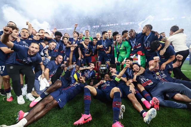 Paris Saint-Germain's Brazilian players celebrate after winning the UEFA Champions League final football match between Paris Saint-Germain (PSG) and Arsenal FC at the Puskas Arena in Budapest on May 30, 2026. (Photo by Franck FIFE / AFP)