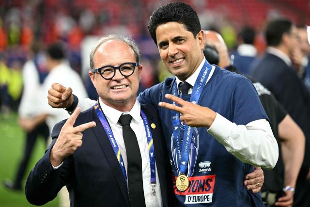 (LtoR) Paris Saint Germain's Portuguese Football Advisor Luis Campos and Paris Saint Germain's Qatari president Nasser al-Khelaifi gesture as they celebrate the team's win of the UEFA Champions League final football match between Paris Saint-Germain (PSG) and Arsenal FC at the Puskas Arena in Budapest on May 30, 2026. (Photo by NICOLAS TUCAT / AFP)