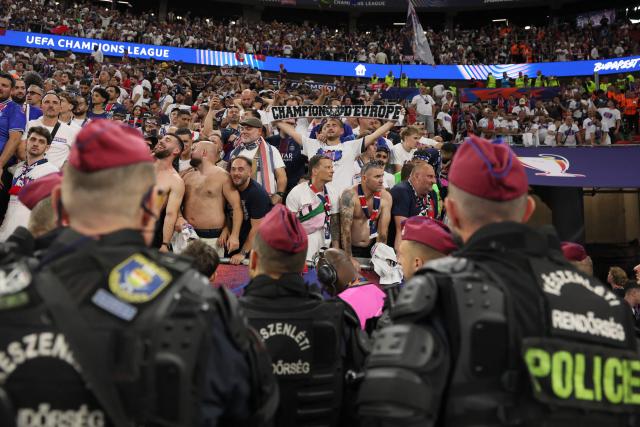 Fans look on after winning the UEFA Champions League final football match between Paris Saint-Germain (PSG) and Arsenal FC at the Puskas Arena in Budapest on May 30, 2026. (Photo by Odd ANDERSEN / AFP)