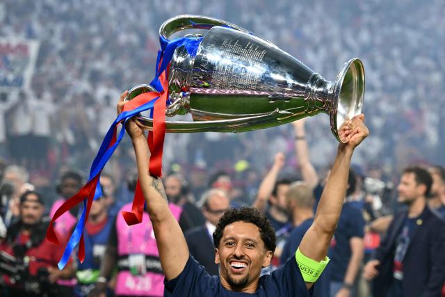 Paris Saint-Germain's Brazilian defender #05 Marquinhos celebrates with the trophy after the team's win of the UEFA Champions League final football match between Paris Saint-Germain (PSG) and Arsenal FC at the Puskas Arena in Budapest on May 30, 2026. (Photo by NICOLAS TUCAT / AFP)