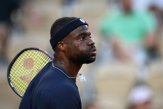 US Frances Tiafoe reacts Portugal's Jaime Faria during their men's singles match on day 7 of the French Open tennis tournament on Court Suzanne-Lenglen at the Roland-Garros Complex in Paris on May 30, 2026. (Photo by Anne-Christine POUJOULAT / AFP)