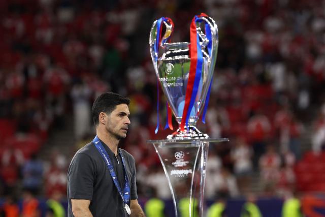 Arsenal's Spanish manager Mikel Arteta walks past the trophy after losing the UEFA Champions League final football match against Paris Saint-Germain (PSG) at the Puskas Arena in Budapest on May 30, 2026. (Photo by FRANCK FIFE / AFP)