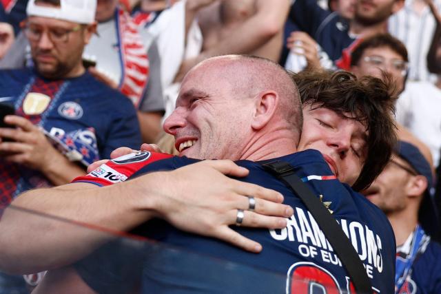 PSG supporters who watched on a giant screen the UEFA Champions League final between Paris Saint-Germain (PSG) and Arsenal FC played in Budapest, celebrate after PSG won, at the Parc des Princes stadium, in Paris on May 30, 2026. (Photo by Kenzo TRIBOUILLARD / AFP)
