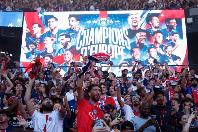 PSG supporters who watched on a giant screen the UEFA Champions League final between Paris Saint-Germain (PSG) and Arsenal FC played in Budapest, celebrate after PSG won, at the Parc des Princes stadium, in Paris on May 30, 2026. (Photo by Kenzo TRIBOUILLARD / AFP)
