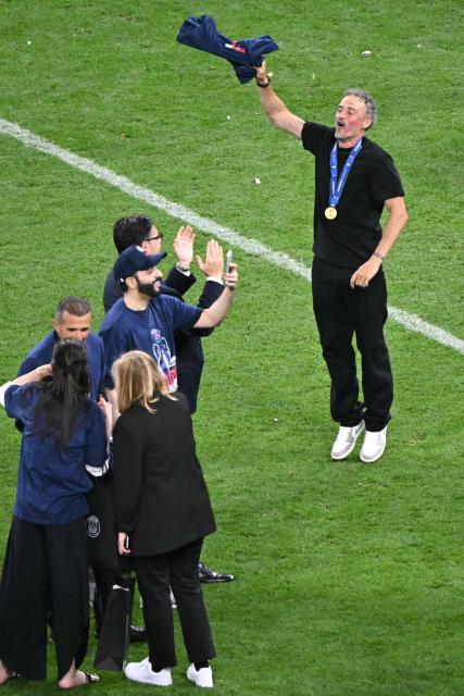 Paris Saint-Germain's Spanish head coach Luis Enrique celebrates after winning the UEFA Champions League final football match between Paris Saint-Germain (PSG) and Arsenal FC at the Puskas Arena in Budapest on May 30, 2026. (Photo by Attila KISBENEDEK / AFP)