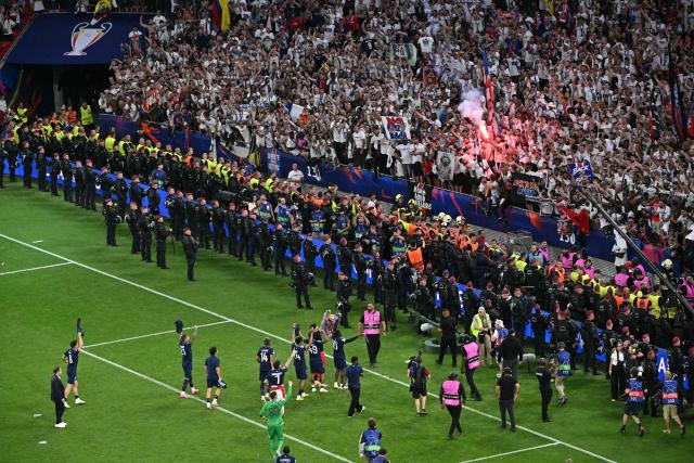Paris Saint-Germain players celebrate with their fans after winning the UEFA Champions League final football match between Paris Saint-Germain (PSG) and Arsenal FC at the Puskas Arena in Budapest on May 30, 2026. (Photo by Attila KISBENEDEK / AFP)