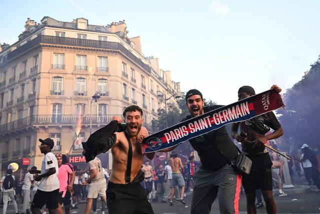 PSG supporters celebrate their team's win in the UEFA Champions League final against Arsenal FC played in Budapest, at rue de Rivoli in downtown Paris on May 30, 2026. (Photo by LOU BENOIST / AFP)
