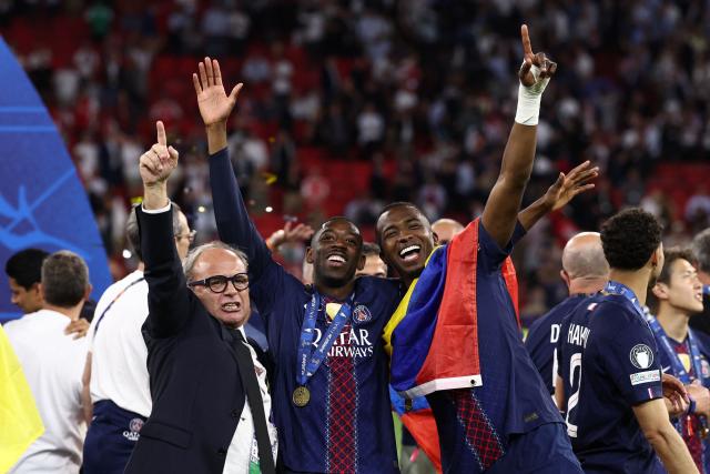 (From L) Paris Saint Germain's Portuguese Football Advisor Luis Campos, Paris Saint-Germain's French forward #10 Ousmane Dembele and Paris Saint-Germain's Ecuadoran defender #51 Willian Pacho celebrate after winning the UEFA Champions League final football match between Paris Saint-Germain (PSG) and Arsenal FC at the Puskas Arena in Budapest on May 30, 2026. (Photo by FRANCK FIFE / AFP)
