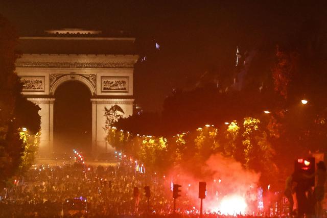 PSG supporters gather on the Champs-Elysees Avenue after the club won the UEFA Champions League final between Paris Saint-Germain (PSG) and Arsenal FC played in Budapest, in Paris on May 30, 2026. (Photo by ROMEO BOETZLE / AFP) / ALTERNATE CROP