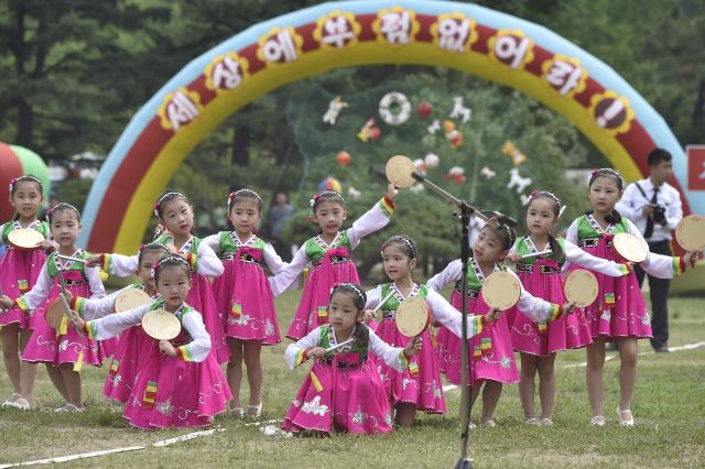 Children perform at the joint friendship gathering to mark the 76th anniversary of the International Children's Day at the Taesongsan Pleasure Park in Pyongyang on June 1, 2026. (Photo by KIM Won Jin / AFP)