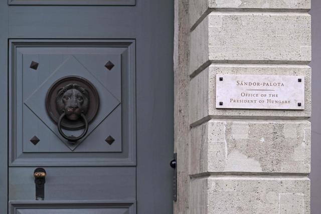 A plaque on the wall by the door reads 'Sandor-Palota (Sandor-palace) Office of the President of Hungary' in Budapest, Hungary, on June 1, 2026. The meeting takes place a day after a deadline set out by Magyar for the resignation of Sulyok has passed. The prime minister has urged top state officials, whom he called puppets of his predecessor, to step down by the end of May or face removal from office. (Photo by Attila KISBENEDEK / AFP)