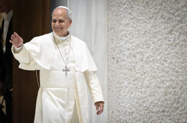 Pope Leo XIV waves as he arrives for an audience in the Paul VI Hall in the Vatican on 1 June 2026, for a meeting with members of the Italian Association of Catholic Guides and Scouts of Europe (Photo by TIZIANA FABI / AFP)