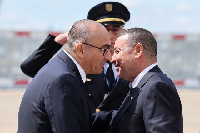 Algeria's Interior and Transport Minister Said Sayoud (r) is welcomed by France's Interior Minister Laurent Nunez (L) upon his arrival at Roissy-Charles de Gaulle Airport, outside Paris on June 1, 2026. Sayoud is expected to meet his French counterpart for a ‘working visit’, which could mark a new stage in the thawing of relations between Algeria and France. (Photo by Kenzo TRIBOUILLARD / AFP)
