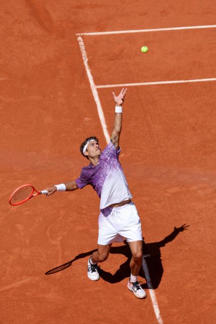 Italy's Flavio Cobolli serves to US Zachary Svajda during their men's singles match on day 9 of the French Open tennis tournament on Court Philippe-Chatrier at the Roland-Garros Complex in Paris on June 1, 2026. (Photo by Thomas SAMSON / AFP)