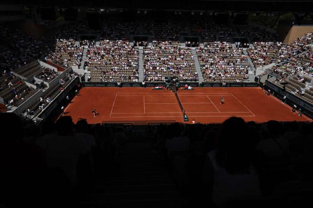 Austria's Anastasia Potapova (L) plays a forehand return to Anna Kalinskaya during their women's singles match on day 9 of the French Open tennis tournament on Court Suzanne-Lenglen at the Roland-Garros Complex in Paris on June 1, 2026. (Photo by Anne-Christine POUJOULAT / AFP)