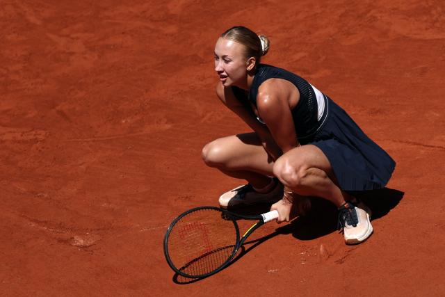 Austria's Anastasia Potapova squats down as she plays against Anna Kalinskaya during their women's singles match on day 9 of the French Open tennis tournament on Court Suzanne-Lenglen at the Roland-Garros Complex in Paris on June 1, 2026. (Photo by Anne-Christine POUJOULAT / AFP)