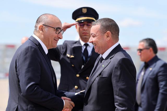 CORRECTION / Algeria's Interior and Transport Minister Said Sayoud (C) is welcomed by France's Interior Minister Laurent Nunez (L) upon his arrival at Le Bourget Airport, outside Paris on June 1, 2026. Sayoud is expected to meet his French counterpart for a ‘working visit’, which could mark a new stage in the thawing of relations between Algeria and France. (Photo by Kenzo TRIBOUILLARD / AFP) / “The erroneous mention[s] appearing in the metadata of this photo by Kenzo TRIBOUILLARD has been modified in AFP systems in the following manner: [Le Bourget airport] instead of [Roissy-Charles-de-Gaulle airport]. Please immediately remove the erroneous mention[s] from all your online services and delete it (them) from your servers. If you have been authorized by AFP to distribute it (them) to third parties, please ensure that the same actions are carried out by them. Failure to promptly comply with these instructions will entail liability on your part for any continued or post notification usage. Therefore we thank you very much for all your attention and prompt action. We are sorry for the inconvenience this notification may cause and remain at your disposal for any further information you may require.”