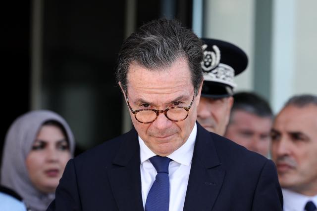 France's ambassador to Algeria Stephane Romatet looks on as he waits for the arrival of Algeria's Interior and Transport Minister Said Sayoud  at Le Bourget Airport, outside Paris on June 1, 2026. Sayoud is expected to meet his French counterpart for a ‘working visit’, which could mark a new stage in the thawing of relations between Algeria and France. (Photo by Kenzo TRIBOUILLARD / AFP)