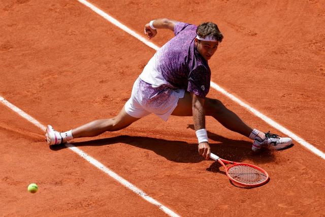 Italy's Flavio Cobolli plays a backhand return to US Zachary Svajda during their men's singles match on day 9 of the French Open tennis tournament on Court Philippe-Chatrier at the Roland-Garros Complex in Paris on June 1, 2026. (Photo by Thomas SAMSON / AFP)