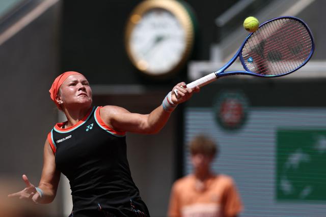 Diana Shnaider plays a forehand return to US Madison Keys during their women's singles match on day 9 of the French Open tennis tournament on Court Suzanne-Lenglen at the Roland-Garros Complex in Paris on June 1, 2026. (Photo by Anne-Christine POUJOULAT / AFP)