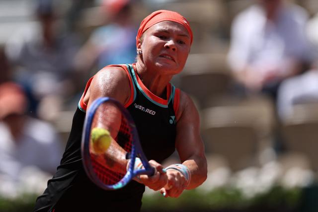 Diana Shnaider plays a backhand return to US Madison Keys during their women's singles match on day 9 of the French Open tennis tournament on Court Suzanne-Lenglen at the Roland-Garros Complex in Paris on June 1, 2026. (Photo by Anne-Christine POUJOULAT / AFP)