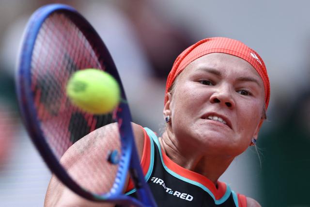 Diana Shnaider plays a backhand return to US Madison Keys during their women's singles match on day 9 of the French Open tennis tournament on Court Suzanne-Lenglen at the Roland-Garros Complex in Paris on June 1, 2026. (Photo by Anne-Christine POUJOULAT / AFP)