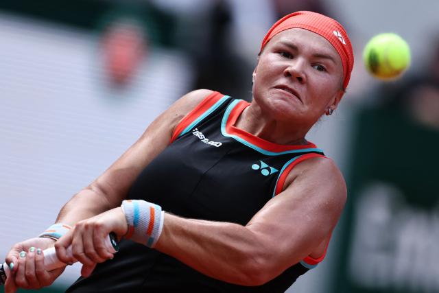 Diana Shnaider plays a backhand return to US Madison Keys during their women's singles match on day 9 of the French Open tennis tournament on Court Suzanne-Lenglen at the Roland-Garros Complex in Paris on June 1, 2026. (Photo by Anne-Christine POUJOULAT / AFP)