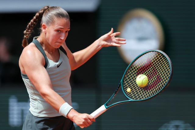 France's Diane Parry plays a backhand return to Poland's Maja Chwalinska during their women's singles match on day 9 of the French Open tennis tournament on Court Philippe-Chatrier at the Roland-Garros Complex in Paris on June 1, 2026. (Photo by Thomas SAMSON / AFP)