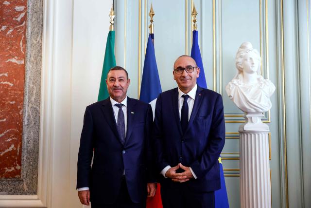 France's Interior Minister Laurent Nunez (R) and Algeria's Interior and Transport Minister Said Sayoud pose during their meeting at the French Interior Ministry in Paris on June 1, 2026. France's Interior minister hists his ALgerian counterpart for a ‘working visit’, which could mark a new stage in the thawing of relations between Algeria and France. (Photo by Kenzo TRIBOUILLARD / POOL / AFP)