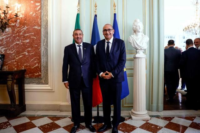 France's Interior Minister Laurent Nunez (R) and Algeria's Interior and Transport Minister Said Sayoud pose during their meeting at the French Interior Ministry in Paris on June 1, 2026. France's Interior minister hists his ALgerian counterpart for a ‘working visit’, which could mark a new stage in the thawing of relations between Algeria and France. (Photo by Kenzo TRIBOUILLARD / POOL / AFP)