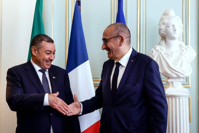 France's Interior Minister Laurent Nunez (R) shakes hands with Algeria's Interior and Transport Minister Said Sayoud during their meeting at the French Interior Ministry in Paris on June 1, 2026. France's Interior minister hists his ALgerian counterpart for a ‘working visit’, which could mark a new stage in the thawing of relations between Algeria and France. (Photo by Kenzo TRIBOUILLARD / POOL / AFP)