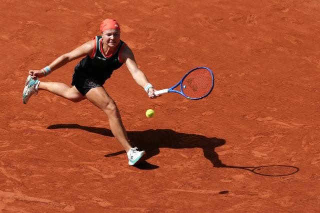 Diana Shnaider plays a forehand return to US Madison Keys during their women's singles match on day 9 of the French Open tennis tournament on Court Suzanne-Lenglen at the Roland-Garros Complex in Paris on June 1, 2026. (Photo by Dimitar DILKOFF / AFP)