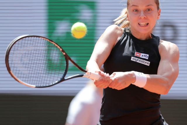 Poland's Maja Chwalinska plays a backhand return to France's Diane Parry during their women's singles match on day 9 of the French Open tennis tournament on Court Philippe-Chatrier at the Roland-Garros Complex in Paris on June 1, 2026. (Photo by Thomas SAMSON / AFP)