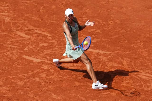 US Madison Keys plays a backhand return to Diana Shnaider during their women's singles match on day 9 of the French Open tennis tournament on Court Suzanne-Lenglen at the Roland-Garros Complex in Paris on June 1, 2026. (Photo by Dimitar DILKOFF / AFP)