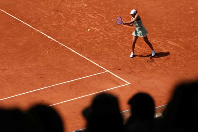 US Madison Keys plays a backhand return to Diana Shnaider during their women's singles match on day 9 of the French Open tennis tournament on Court Suzanne-Lenglen at the Roland-Garros Complex in Paris on June 1, 2026. (Photo by Dimitar DILKOFF / AFP)