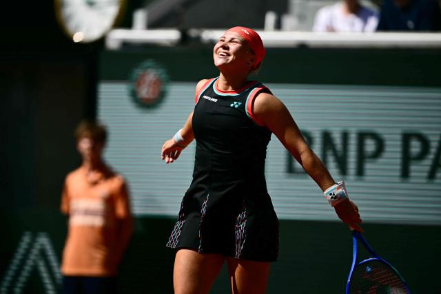 Diana Shnaider celebrates her victory over US Madison Keys at the end of their women's singles match on day 9 of the French Open tennis tournament on Court Suzanne-Lenglen at the Roland-Garros Complex in Paris on June 1, 2026. (Photo by JULIEN DE ROSA / AFP)