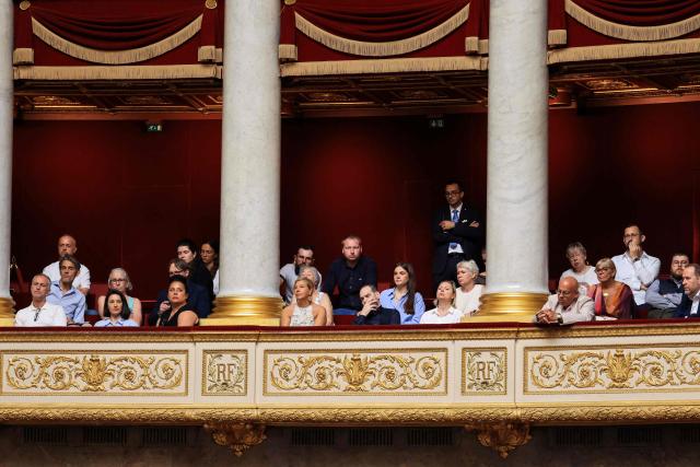 Family members of victims and representatives of association for the children's protection attend the debate on child protection and on tackling violence in schools at the National Assembly, France's Parliament lower house, in Paris on June 1, 2026. (Photo by Ludovic MARIN / AFP)
