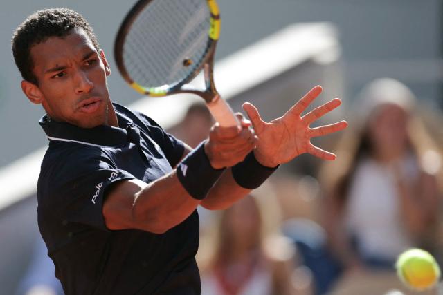 Canada's Felix Auger-Aliassime plays a forehand return to Chile's Alejandro Tabilo during their men's singles match on day 9 of the French Open tennis tournament on Court Philippe-Chatrier at the Roland-Garros Complex in Paris on June 1, 2026. (Photo by Thomas SAMSON / AFP)