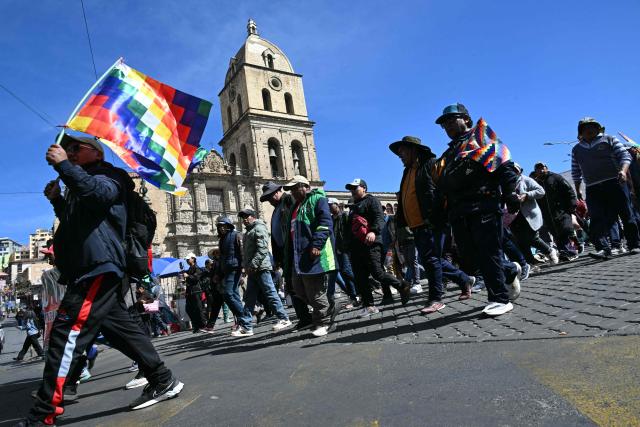 People take part in a protest march by neighborhood councils from El Alto calling for the resignation of President Rodrigo Paz, in La Paz on June 1, 2026. (Photo by AIZAR RALDES / AFP)