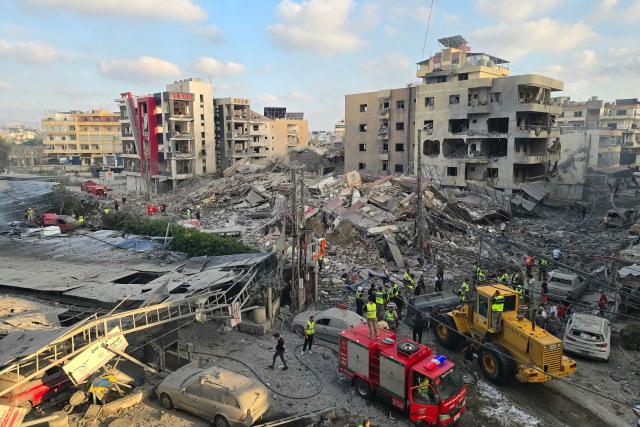 First responders gather at the site of an Israeli strike that hit near a hospital in the southern Lebanese city of Tyre on June 1, 2026. Lebanon said an Israeli strike hit near a hospital in the southern city of Tyre on June 1 as the health ministry shared footage showing heavy damage to the facility. The state-run National News Agency said a strike targeting an intersection near the Jabal Amel hospital "hit a building and the parking lot, resulting in a number of wounded". (Photo by KAWNAT HAJU / AFP)