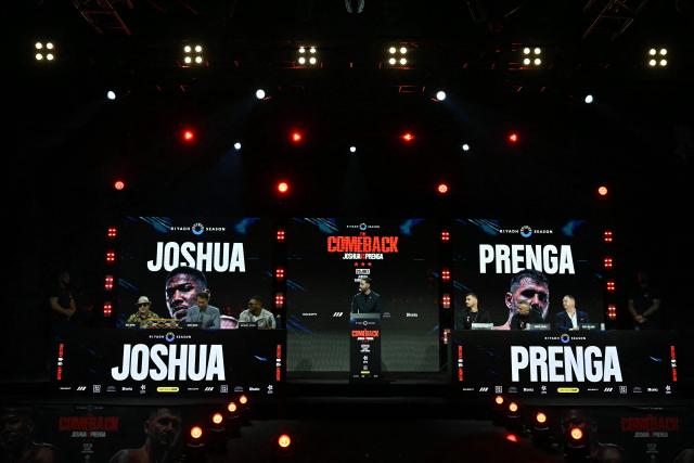 Albania's Kristian Prenga (3R) and Britain's Anthony Joshua (3L) attend a press conference in London on June 1, 2026, ahead of their boxing match in Saudi Arabia in July. (Photo by Ben STANSALL / AFP)