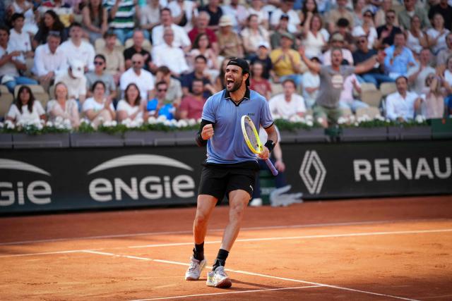Italy's Matteo Berrettini reacts to a point against Argentina's Juan Manuel Cerundolo during their men's singles match on day 9 of the French Open tennis tournament on Court Suzanne-Lenglen at the Roland-Garros Complex in Paris on June 1, 2026. (Photo by Dimitar DILKOFF / AFP)