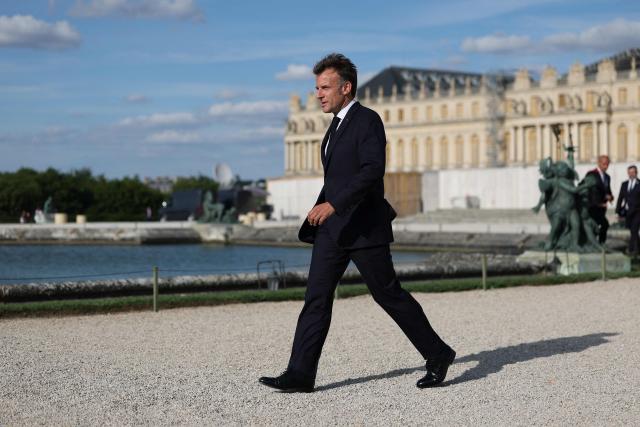 French President Emmanuel Macron arrives to deliver a speech during the "Choose France" business summit, aimed at attracting foreign investors to the country, at the Chateau de Versailles in Versailles on June 1, 2026. (Photo by Gonzalo Fuentes / POOL / AFP)