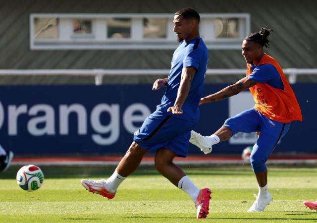 France's forward #11 Michael Olise (R) shoots the ball in front of France's defender #26 Maxence Lacroix during a training session at the national team training grounds in Clairefontaine-en-Yvelines, southwest of Paris, on June 1, 2026, as part of their preparation for the upcoming 2026 FIFA World Cup football tournament. (Photo by FRANCK FIFE / AFP)